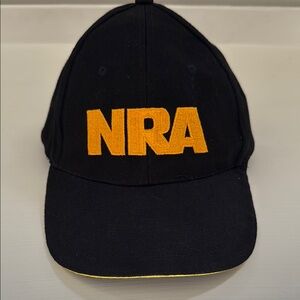 Black baseball cap with gold embroidered logo